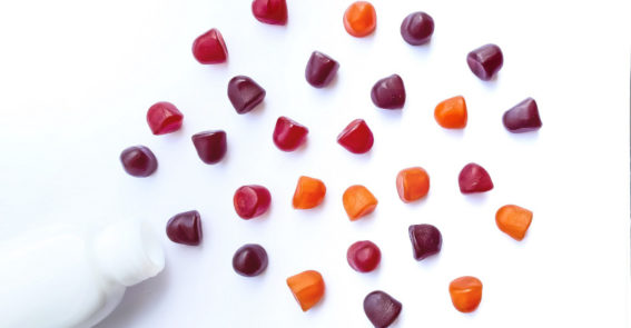 Group,Of,Red,,Orange,And,Purple,Multivitamin,Gummies,With,The